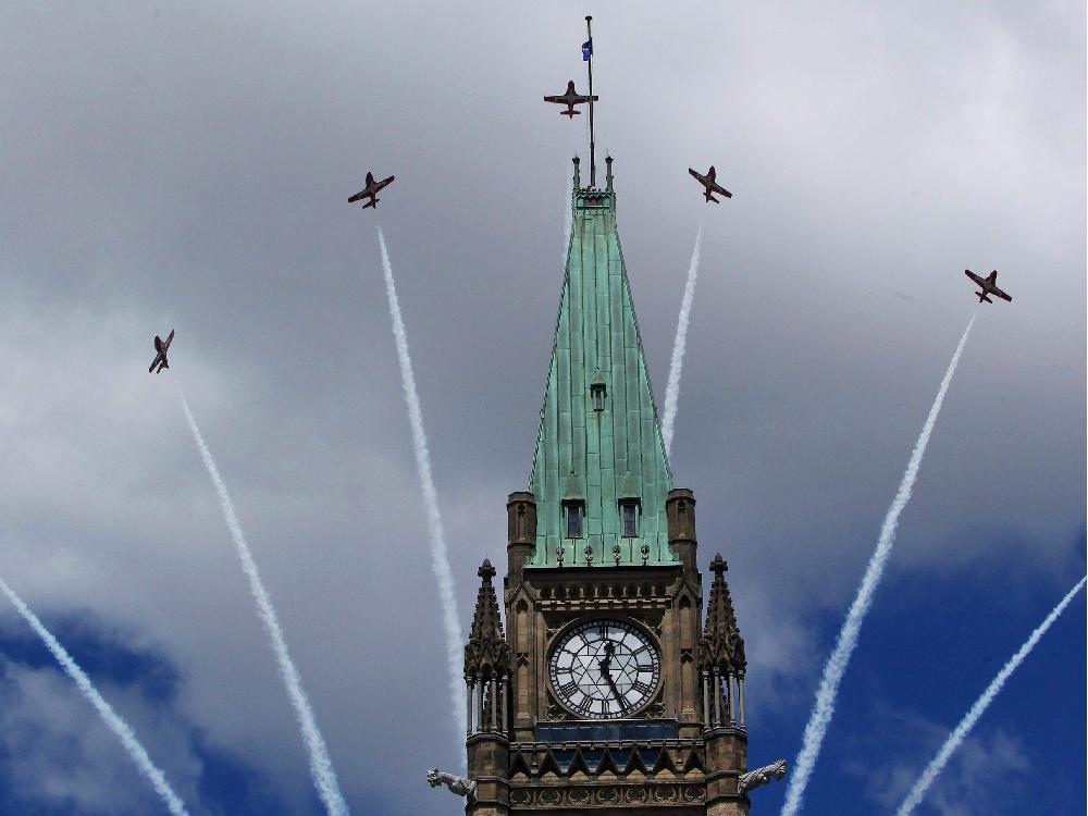 canadian-snowbirds-fly-over-top-of-the-peace-tower-during-canada-day-celebration.jpg